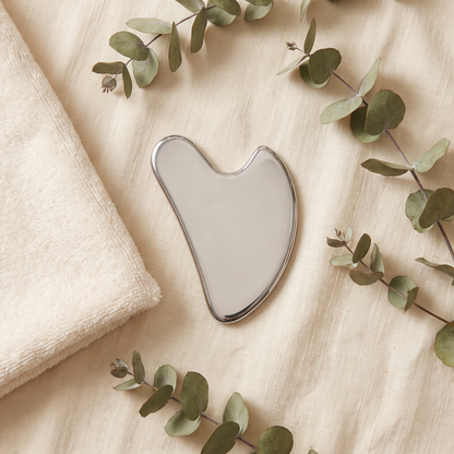 Senvè Gua Sha flat lay with eucalyptus
