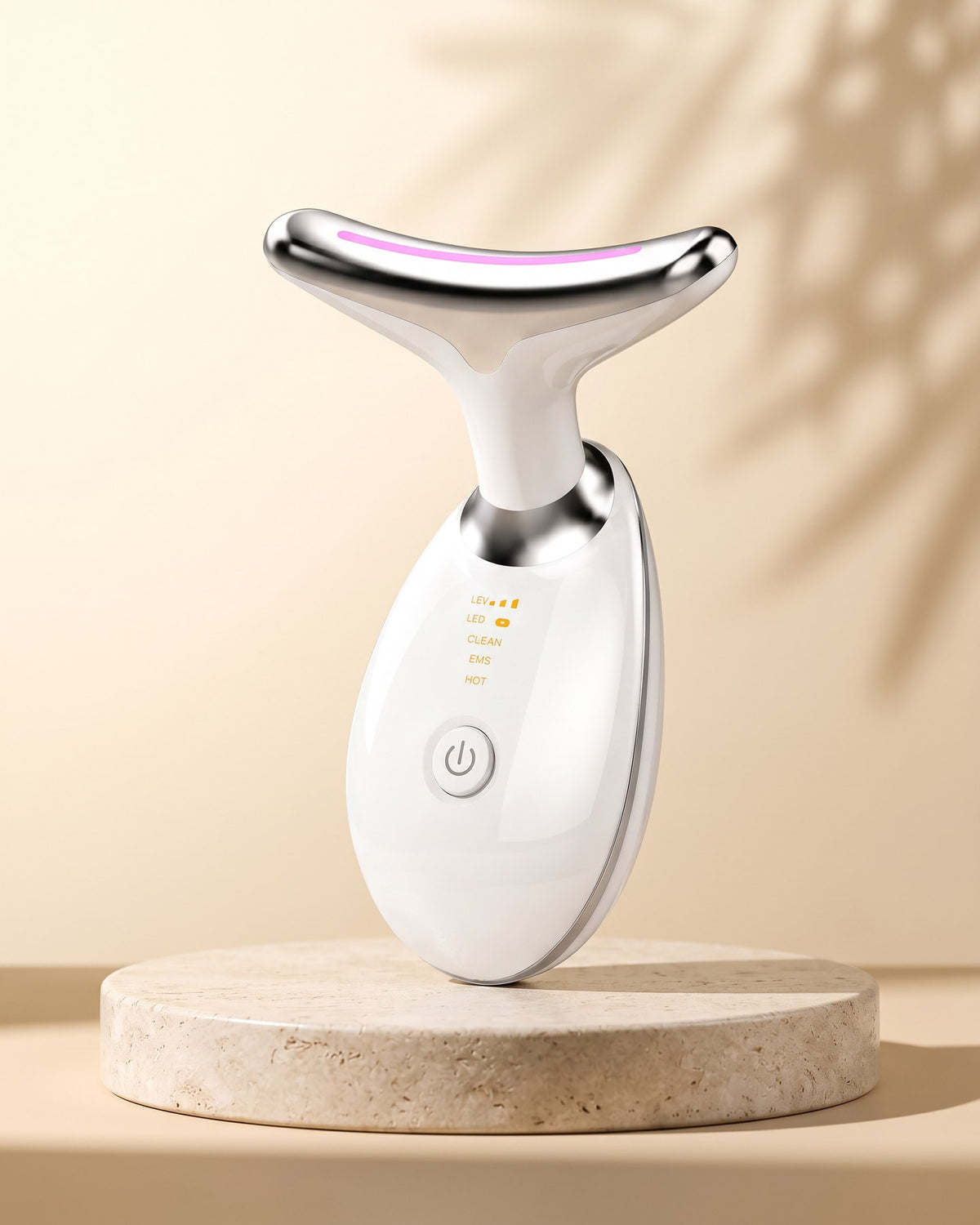SENVÈ Neck & Facial Massager on a travertine plinth